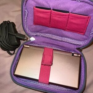 Nintendo Handheld Console with Purple and Pink Case